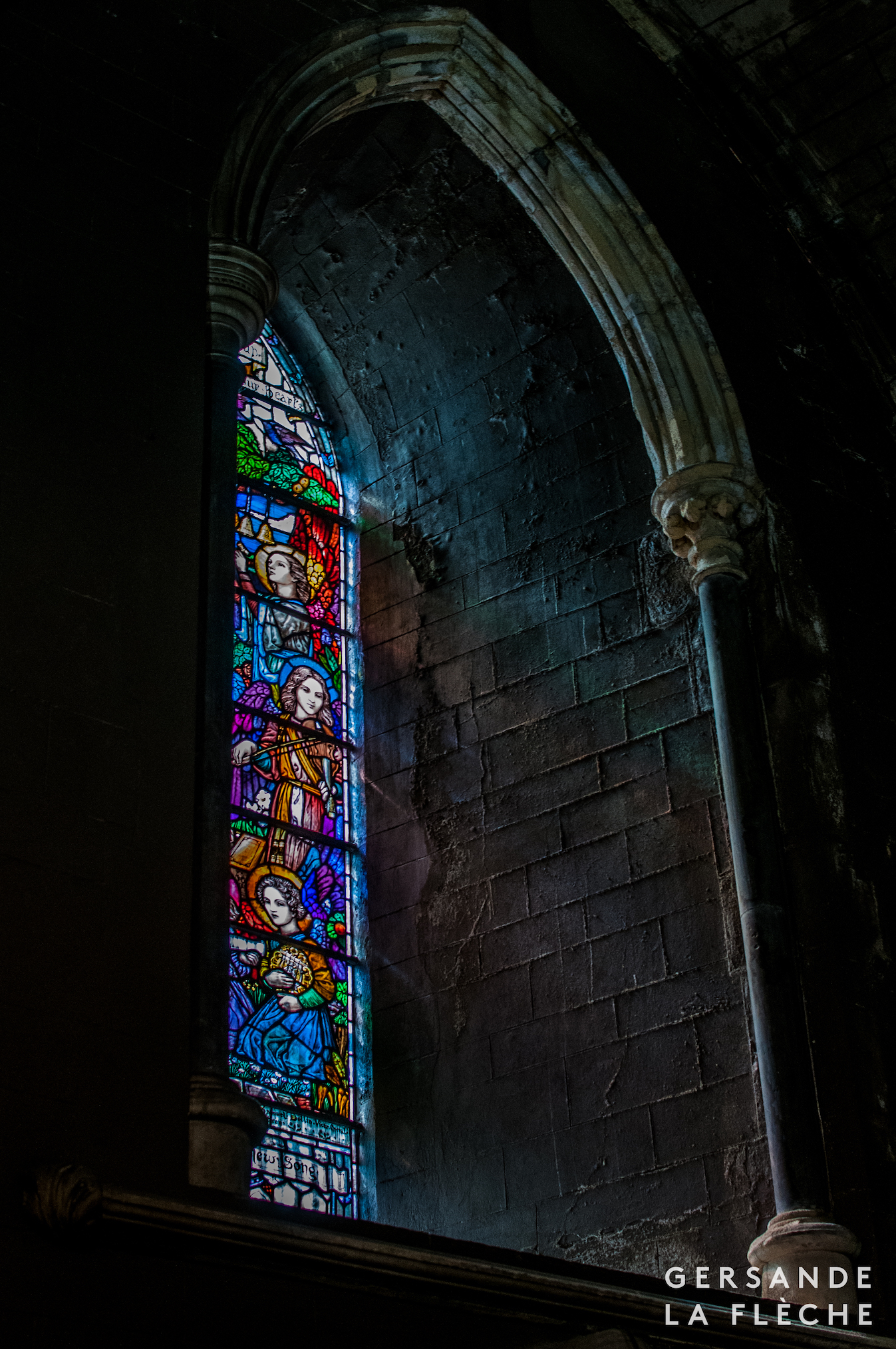 A photo by the author of a stained glass window inside St Patrick's cathedral.