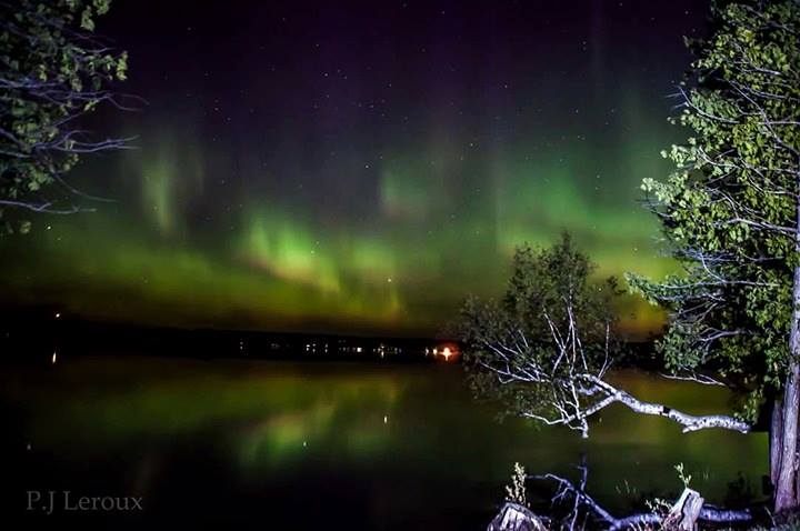 A photograph of the Northern Lights over Golden Lake by photographer P.J. Leroux.
