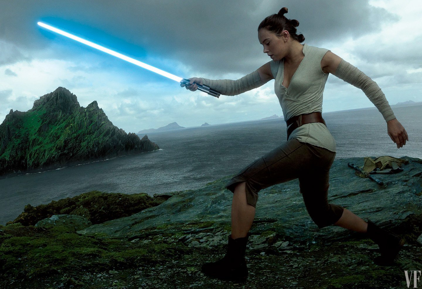 A photo of Daisy Ridley wielding a lightsaber as Rey, against the backdrop of oceans and islands, by one of my favourite photographers of all-time, Annie Leibovitz.