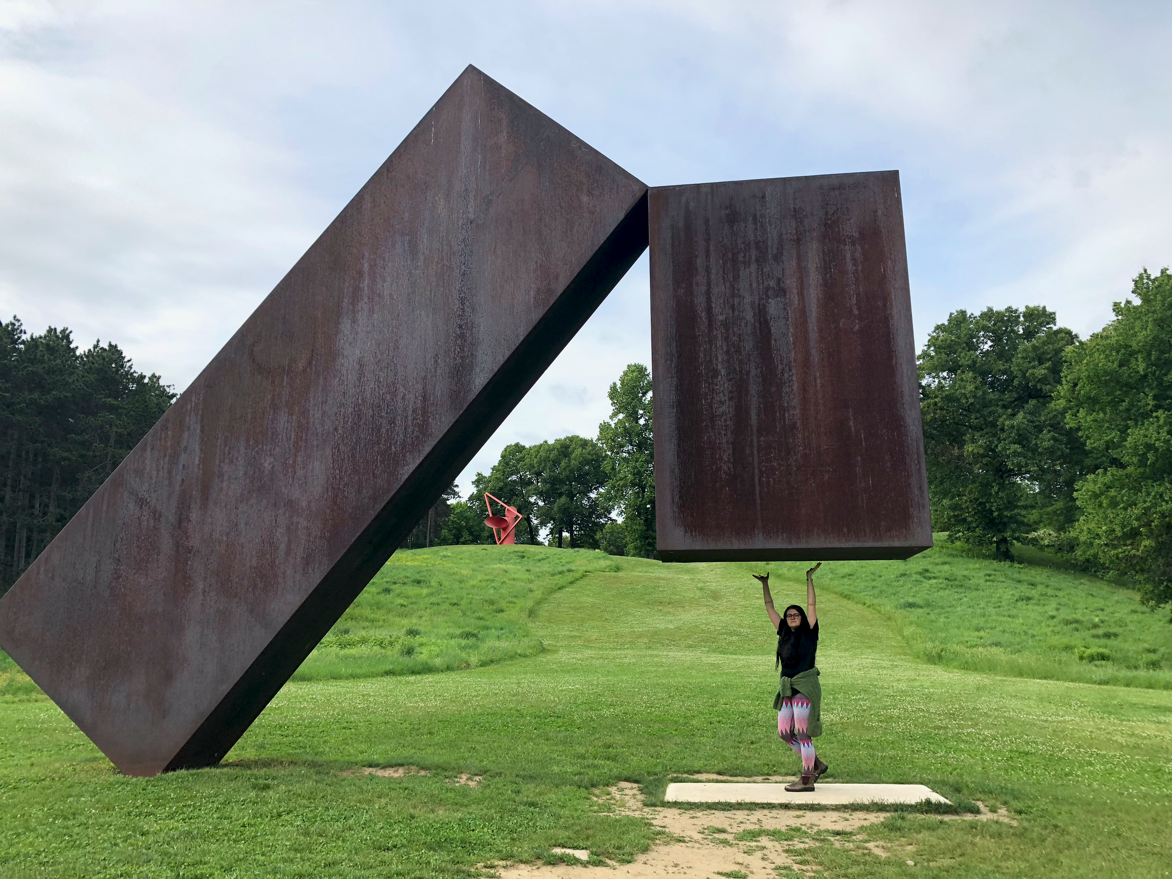 A photo of me standing underneath Menashe Kadishman's Suspended. It's really weird but cool looking. Describing it is hard.